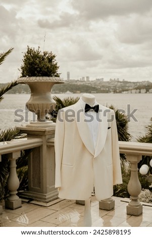 beige suit Hanging on mannequin in outdoor. stock photo