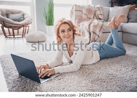 Full size profile photo of creative gorgeous girl barefoot laying floor use laptop brainstorming coworking bright house inside