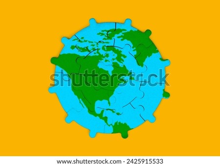 Gear-shaped jigsaw puzzle depicting the green North American continent surrounded by vast oceans. Geography, mechanics and global connectivity related concept.