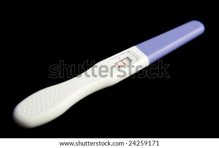 Pregnancy test on black ground