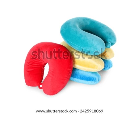 Many soft travel pillows isolated on white Royalty-Free Stock Photo #2425918069
