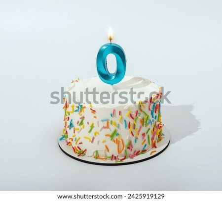 0 shaped candle light on happy birthday cake
