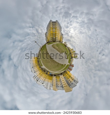 tiny planet in blue sky with clouds in city center near modern skyscrapers. Transformation of spherical 360 panorama in abstract aerial view.