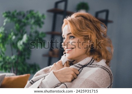 Profile photo of adorable satisfied glad person beaming smile arms hold cover herself warm comfy blanket free time house inside Royalty-Free Stock Photo #2425931715