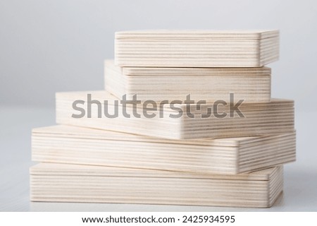 Wooden photo box for photo storage on wooden white background. Stack of boxes on white. set for the photographer, presentable set of photos, luxury feedback to client. Royalty-Free Stock Photo #2425934595