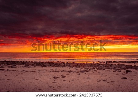 Midnight sun on the horizon of the Norwegian Sea, sunset in the Lofoten Islands, Norway Royalty-Free Stock Photo #2425937575