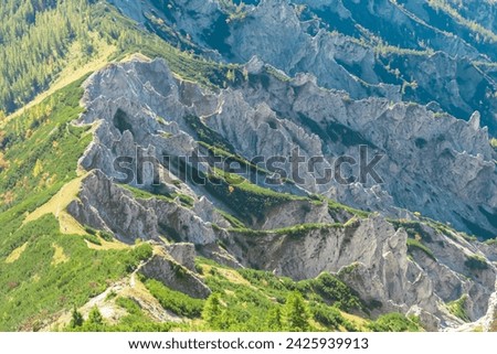 Panoramic view of unique rock formation in Hochschwab mountain range, Styria, Austria, Scenic hiking trail from Karlhochkogel via Kaefereck to Sankt Ilgen. Escapism in remote Austrian Alps. Wanderlust Royalty-Free Stock Photo #2425939913
