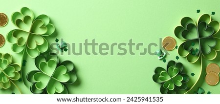 St Patrick's Day banner design with four leaf clover paper art, gold coins, confetti.