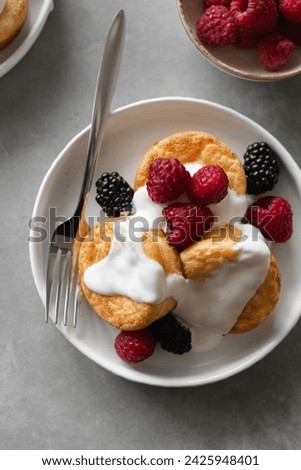 Overhead view of cottage cheese pancakes served with berries