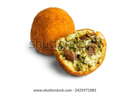 Arancino isolated on white background cut in half. Filled with pistachio sauce, mozzarella and meat. Italian fried rice balls, coated with breadcrumbs and deep fried. Sicilian street food. Royalty-Free Stock Photo #2425971081