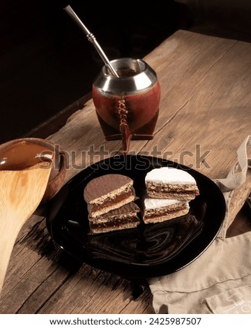 Argentine Alfajor with chocolate and meringue filled with dulce de leche