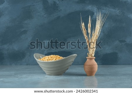 Yellow pea beans in a bowl on blue background. High quality photo