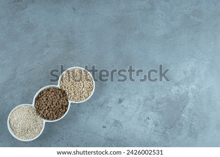 Sunflower, pumpkin seeds and rice grains in white cups. High quality photo