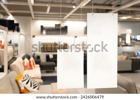 Blank sign inside shopping mall. mock up advertise display frame setting over the shopping department store. copy space. Royalty-Free Stock Photo #2426006479