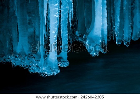 Icicles over running water, Partnach Gorge, Upper Bavaria, Germany Royalty-Free Stock Photo #2426042305