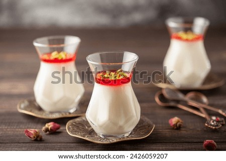 Malabi (muhallebi) milk rice pudding with pistachios. Arabic dessert