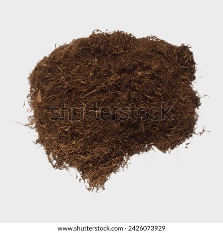 Nicotiana tabacum leaves that have been dried and chopped, focus on the brown dry tobacco. it has been finely cut and the background is white, Indonesian Tobacco. Royalty-Free Stock Photo #2426073929