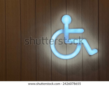 Neon light disabled wheelchair icon, toilet sign.
