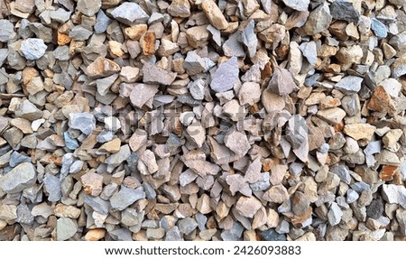 Gravel is a basic material in infrastructure development. It is usually taken from river rocks and crushed into small pieces. Royalty-Free Stock Photo #2426093883