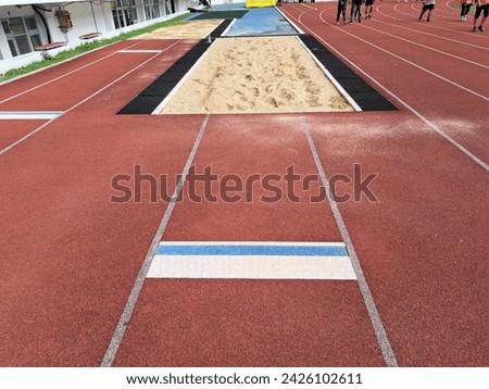 Long jump track on an athletic field Royalty-Free Stock Photo #2426102611