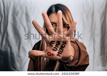 Women in fear of violence. Enough! 8th March, International Women Day. Vulnerable women yearning for freedom without abuse. Not one woman less, women demanding equality. Royalty-Free Stock Photo #2426104389