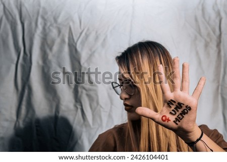 Women in fear of violence. Enough! 8th March, International Women Day. Vulnerable women yearning for freedom without abuse. Not one woman less, women demanding equality. Royalty-Free Stock Photo #2426104401