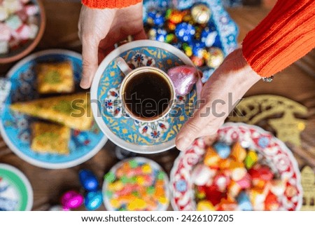 Coffee Pot (Cezve), Coffee, Turkish Coffee Cup (Turk Kahvesi) and Coffee Beans Photo, Colorful Eid Mubarak Candy and Chocolate Uskudar, Istanbul, Turkiye (Turkey) Royalty-Free Stock Photo #2426107205