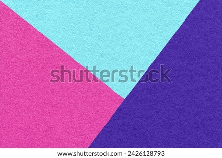 Texture of craft bright purple, navy blue and cerulean shade color paper background, macro. Structure of vintage abstract cardboard with geometric shape and gradient. Felt backdrop closeup.