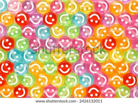 Background of colored beads with smiles.The concept of satisfaction. Smile icons.