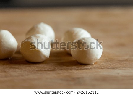 mozzarella balls close-up on wooden board