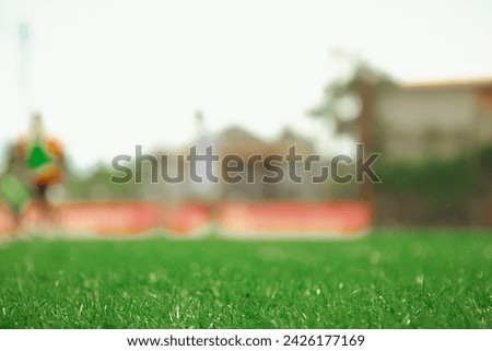 Abstract background green grass field. Blurred or unfocused