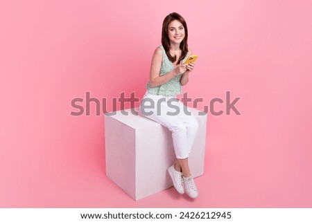 Photo of lovely cute girl popular blogger wear trendy clothes read social media news isolated on pink color background