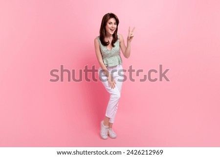 Full length photo of stunning gorgeous lady dressed stylish clothes demonstrate v-sign isolated on pink color background