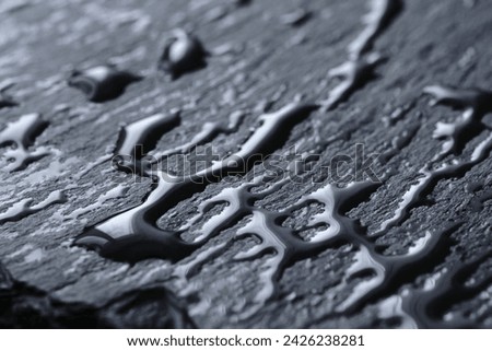 Background, slate wet with drops water board in closeup