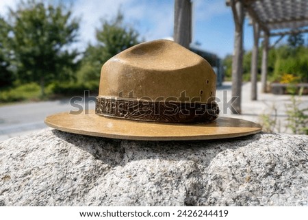 Iconic National Park Service ranger hat on a rock.  Royalty-Free Stock Photo #2426244419