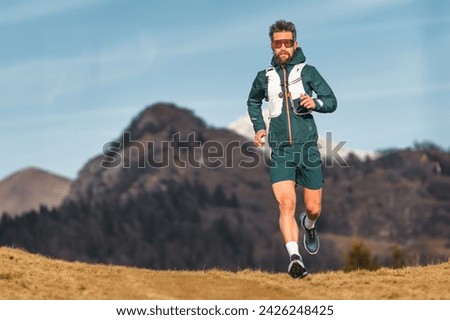 Ultramarathon man runner during a workout in the hill Royalty-Free Stock Photo #2426248425