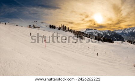 View of a ski slopes at sunset around Sela mountain, Selaronda, Dolomites, Italy Royalty-Free Stock Photo #2426262221