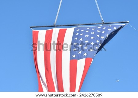 American flag in a blue sky