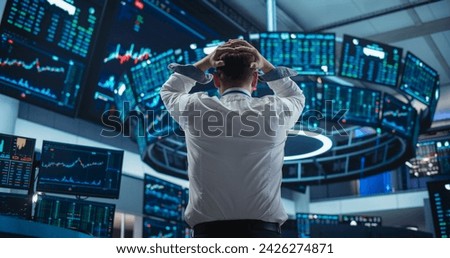 Saddened Businessman Puts His Hands Over His Head, Soaking a Financial Loss on a Deal. Stock Exchange Manager in White Shirt is Depressed After Investment Day. Broker Angry About Economy News Royalty-Free Stock Photo #2426274871