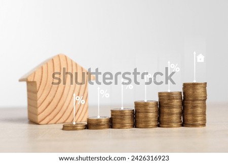 Mortgage rate. Stacked coins, arrows, percent signs and model of house