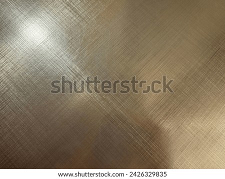 Golden stainless steel reflective texture. Texturized steel with hairline pattern, gold luxury and lush steel.  Royalty-Free Stock Photo #2426329835