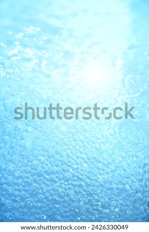Blue water texture. Bubbles bubbling water.
