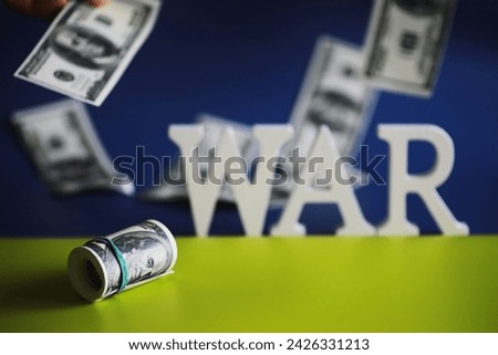 a word war laid by wooden letters dollar banknotes background