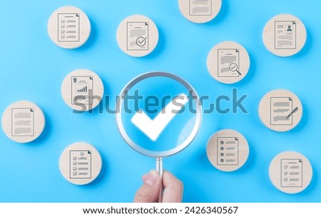 Quality assurance document control concept. Magnifying glass focus on checkmark for document approved paperless and quality assurance approve, Quality standard certificate, Correct sign mark,