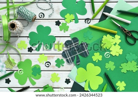 St. Patrick's Day craft supplies green shamrocks clovers for making cards, school DIY art project background