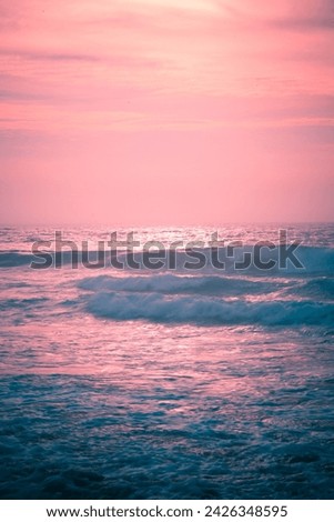 beach sunrise pink blue waves sea