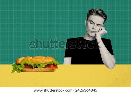 Photo picture of hungry funny guy doubts eat or not baguette huge sandwich with fresh vegetables isolated on green color background