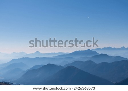 Panoramic view of magical mountain peaks of Karawanks and Julian Alps seen from Goldeck, Latschur group, Gailtal Alps, Carinthia, Austria, EU. Mystical atmosphere in Austrian Alps on sunny summer day. Royalty-Free Stock Photo #2426368573