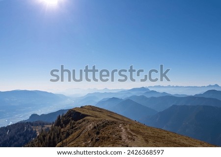 Panoramic view of magical mountain peaks of Karawanks and Julian Alps seen from Goldeck, Latschur group, Gailtal Alps, Carinthia, Austria, EU. Mystical atmosphere in Austrian Alps on sunny summer day. Royalty-Free Stock Photo #2426368597