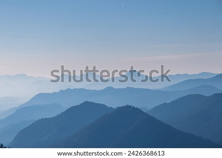 Panoramic view of magical mountain peaks of Karawanks and Julian Alps seen from Goldeck, Latschur group, Gailtal Alps, Carinthia, Austria, EU. Mystical atmosphere in Austrian Alps on sunny summer day. Royalty-Free Stock Photo #2426368613